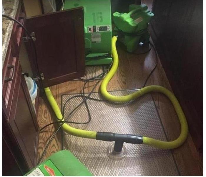 SERVPRO drying equipment being used to dry hardwood floors