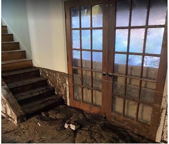 mud and silt in house after mudslide