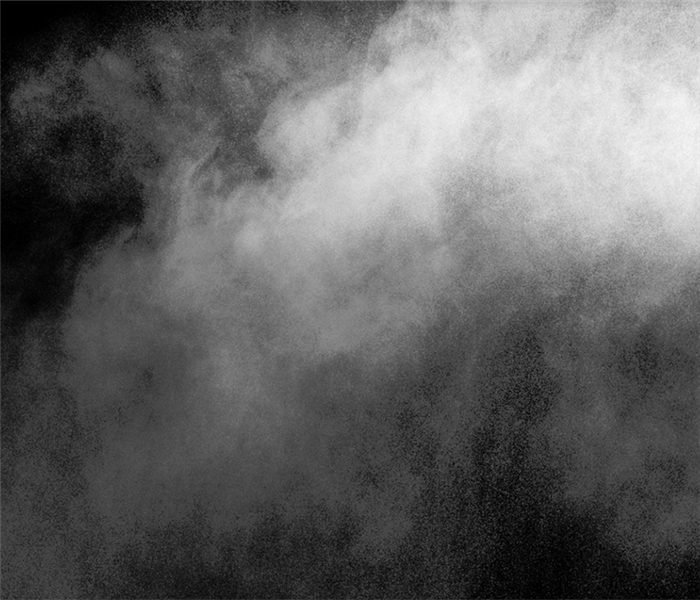 smoke against a black backdrop