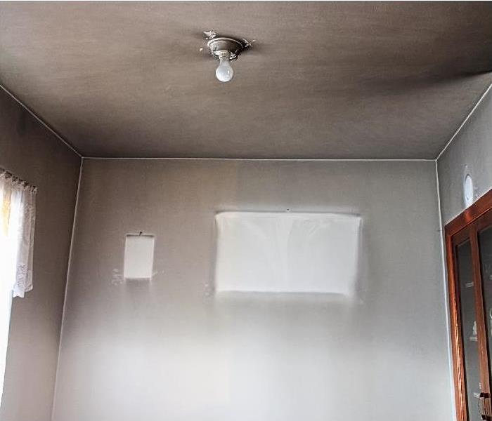 smoke and soot on walls and ceiling